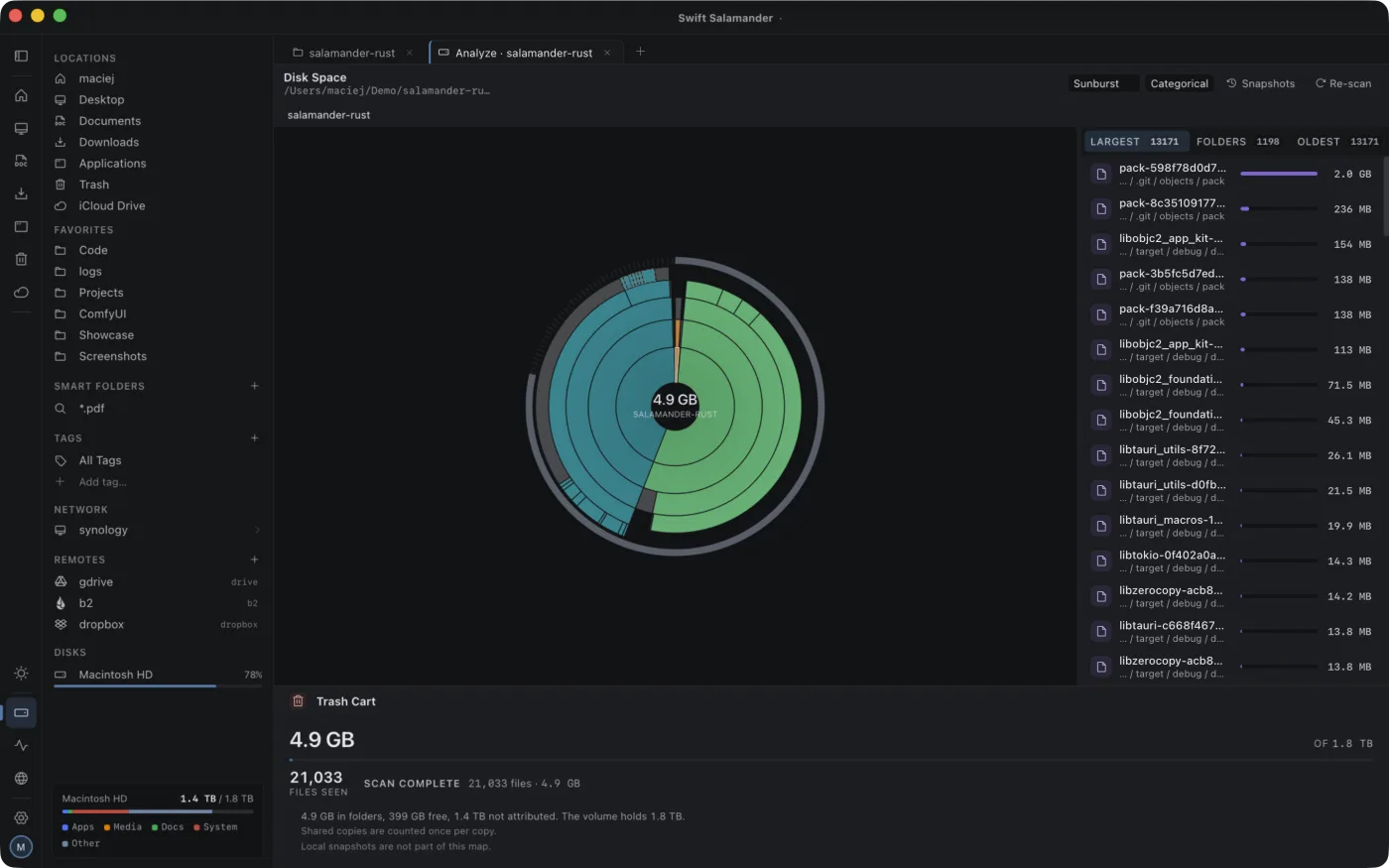 The disk analyzer in dark mode: a sunburst of nested rings with a ranked list of the largest files beside it